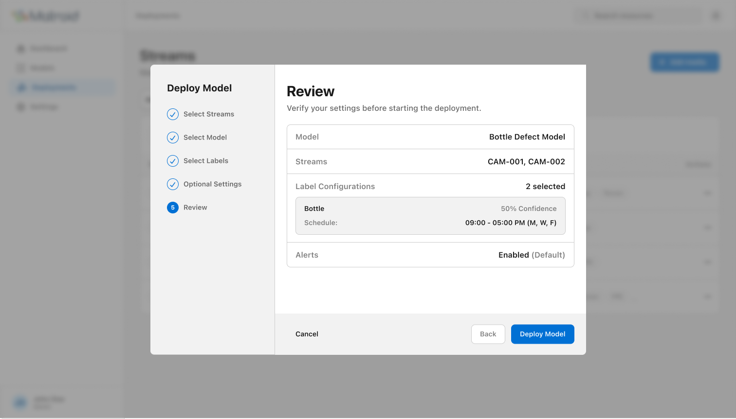 Review deployment step listing model, specific stream IDs, label configurations, and alerts before committing